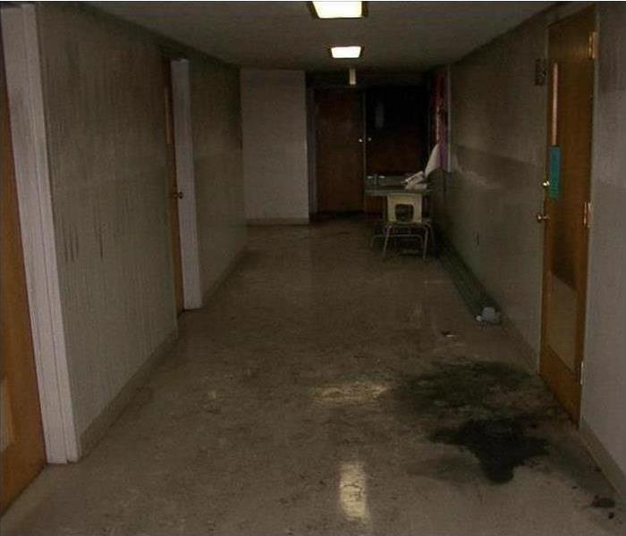 Soot affected hallway with white walls