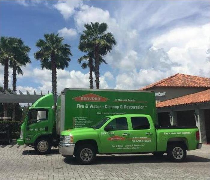 SERVPRO green trucks in front of business building