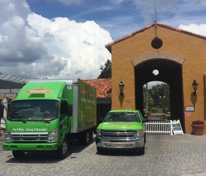 SERVPRO green trucks in front of business building