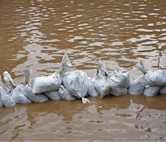 Sandbags assembled to hold back rising water